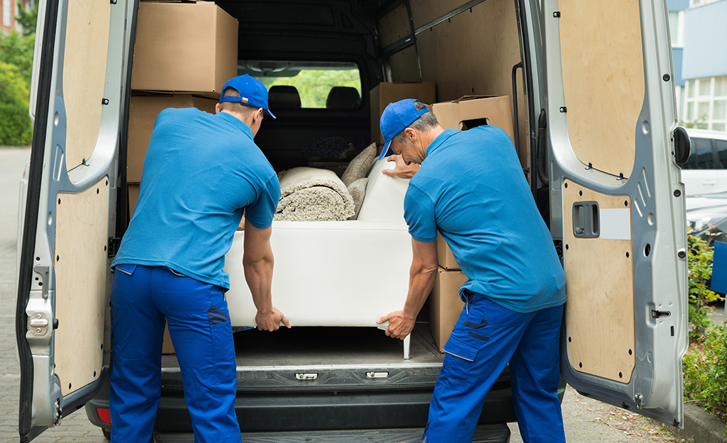 Professional movers in Nashville TN loading furniture into a moving truck during a residential move